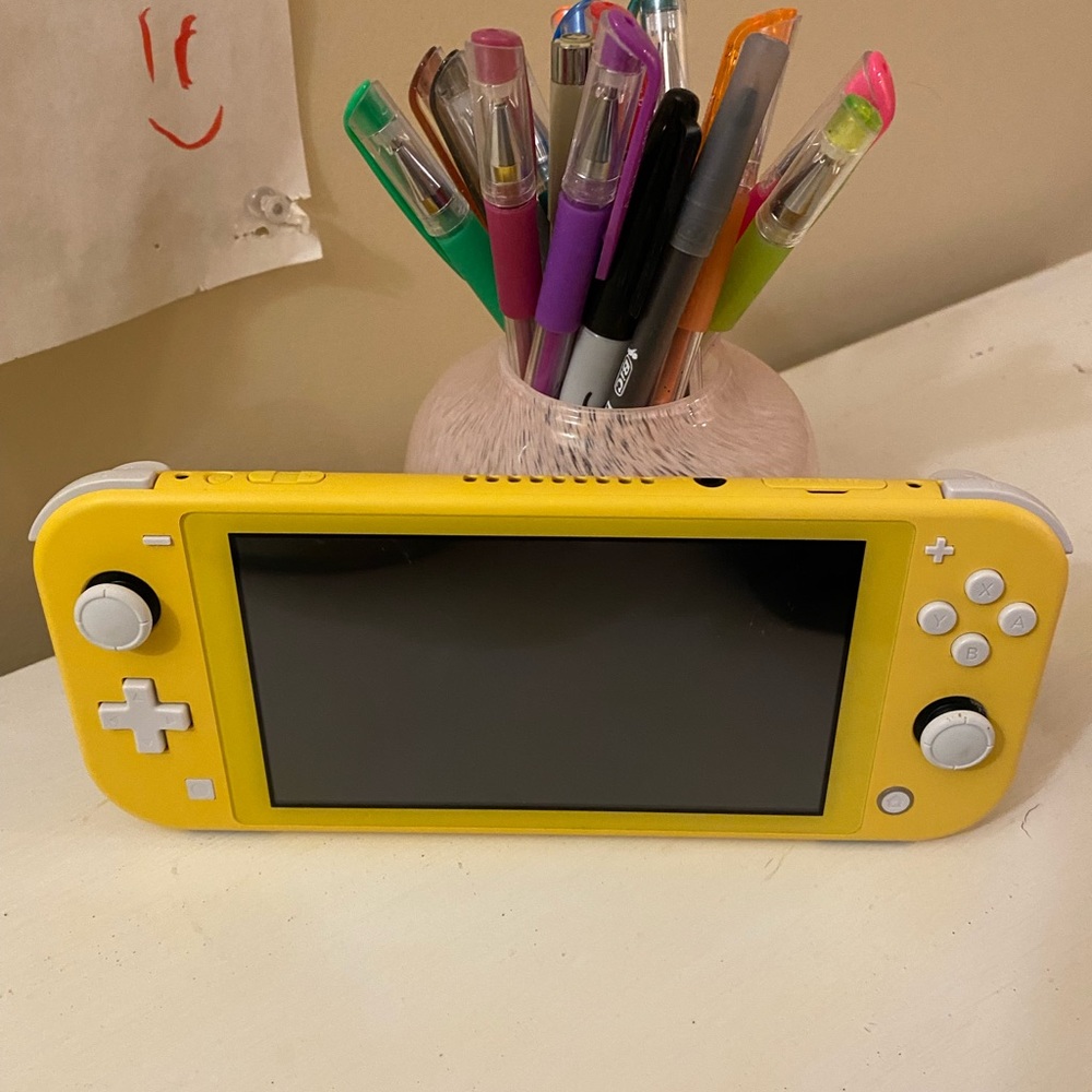 - Nintendo Switch Lite Yellow.  Clean and great condition.